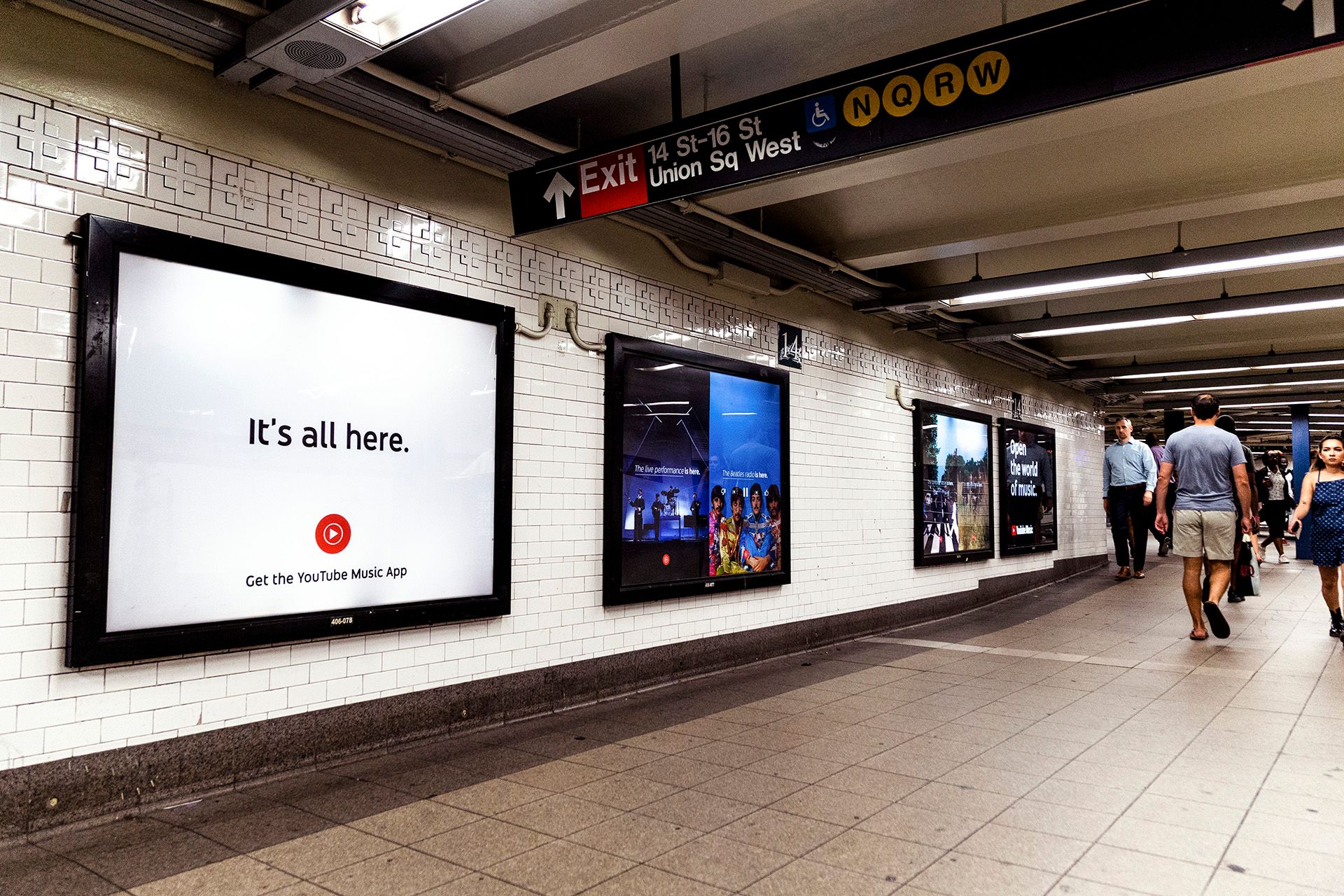 YouTube Music ads on tiled wall in Union Square train station. It's all here. Get the YouTube Music App