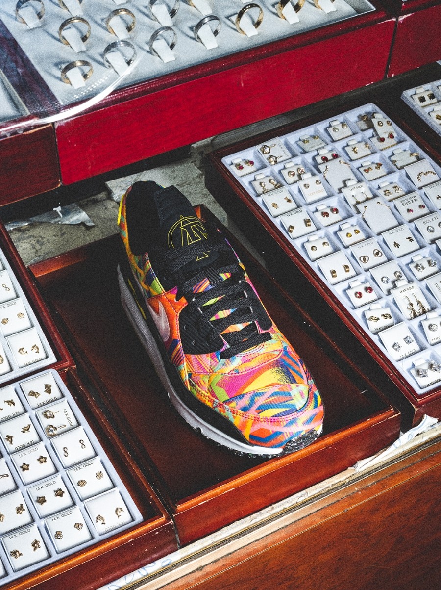 Colorful Nike running shoe in jewelry display case