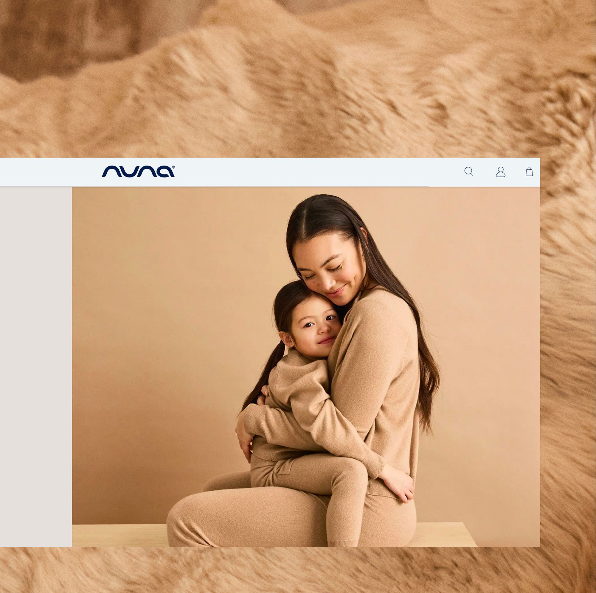 A woman sits and hugs a young child, both wearing matching beige outfits, against a beige background, shown within a browser window.
