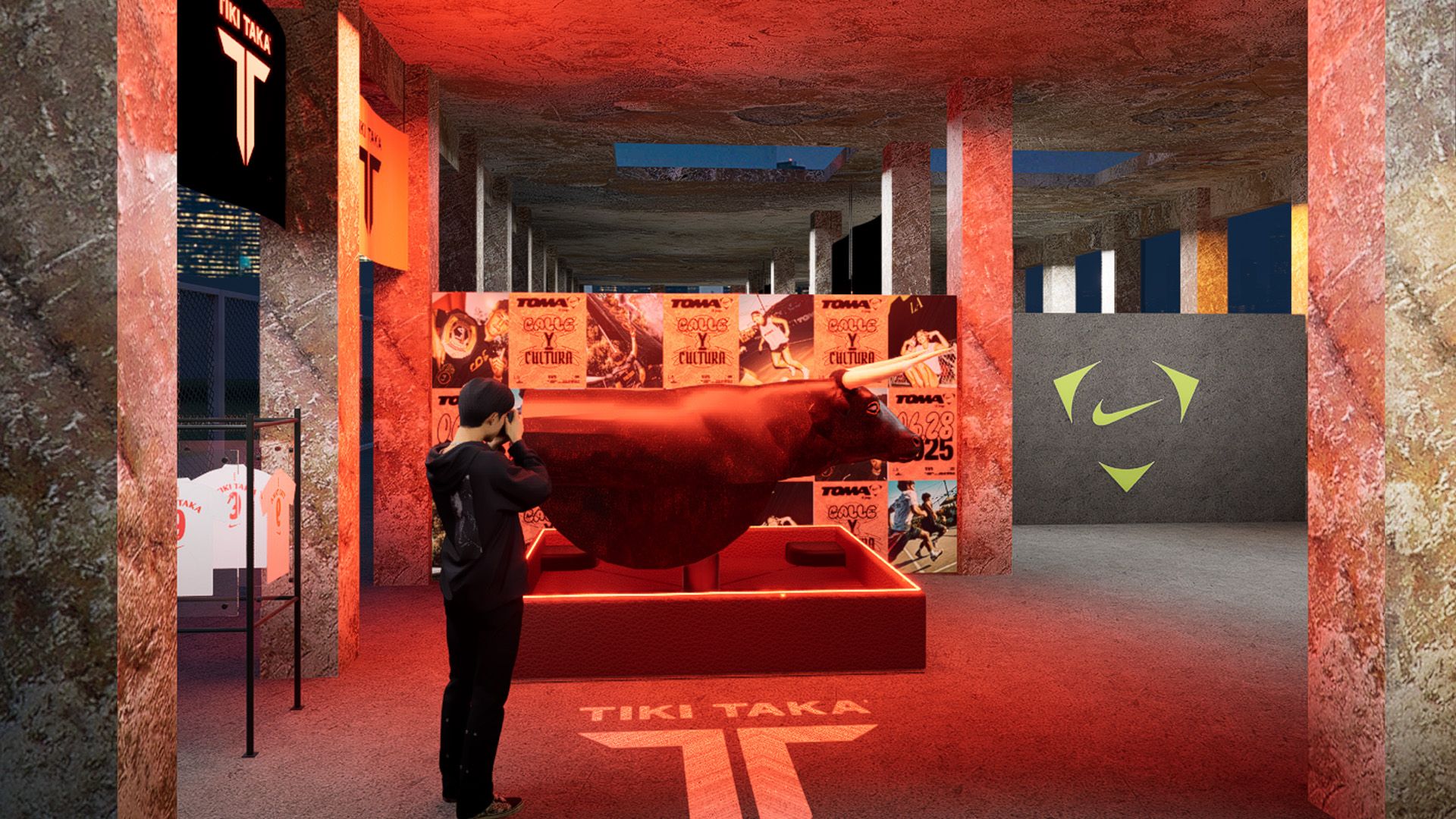 A person stands in a dimly lit, industrial-style room with red lighting, sports posters, a large Tiki Taka sign, and a Nike logo on the far wall.