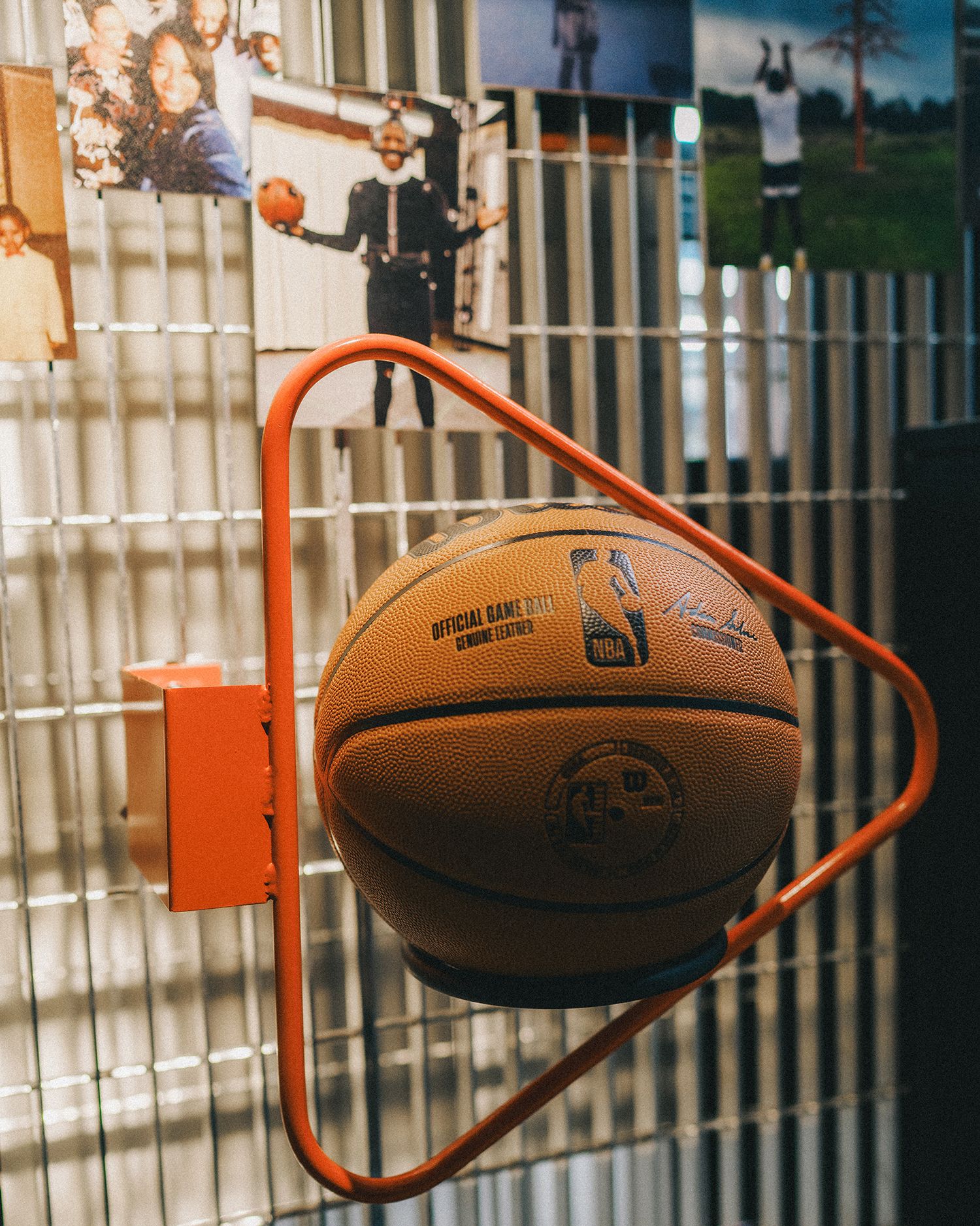 close up of triangle basketball hoop with ball stuck in it