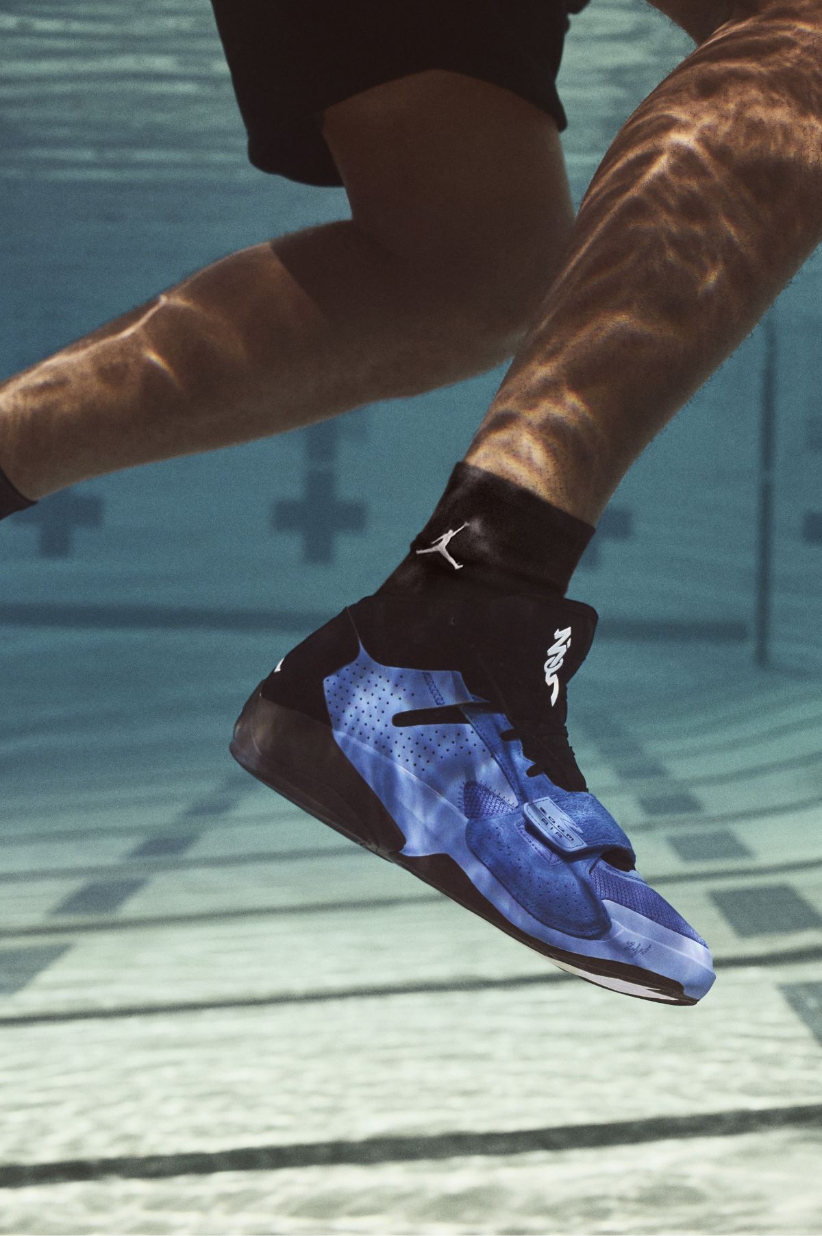 Close up of Zion 2 sneaker underwater in pool