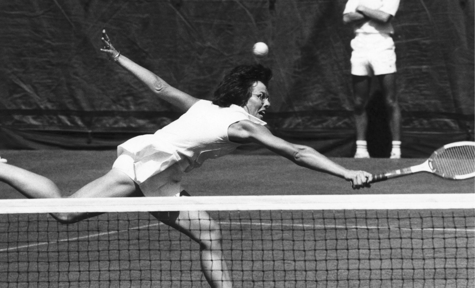 Billie Jean King action vintage playing tennis reaching for shot