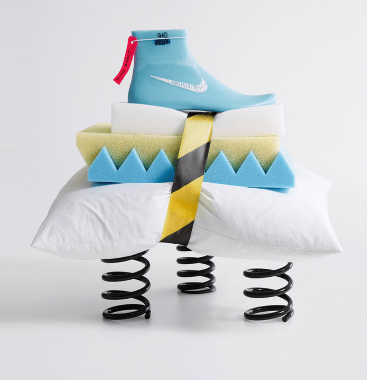 Nike shoe mold with multiple layers of thick foam, a pillow and 3 large springs