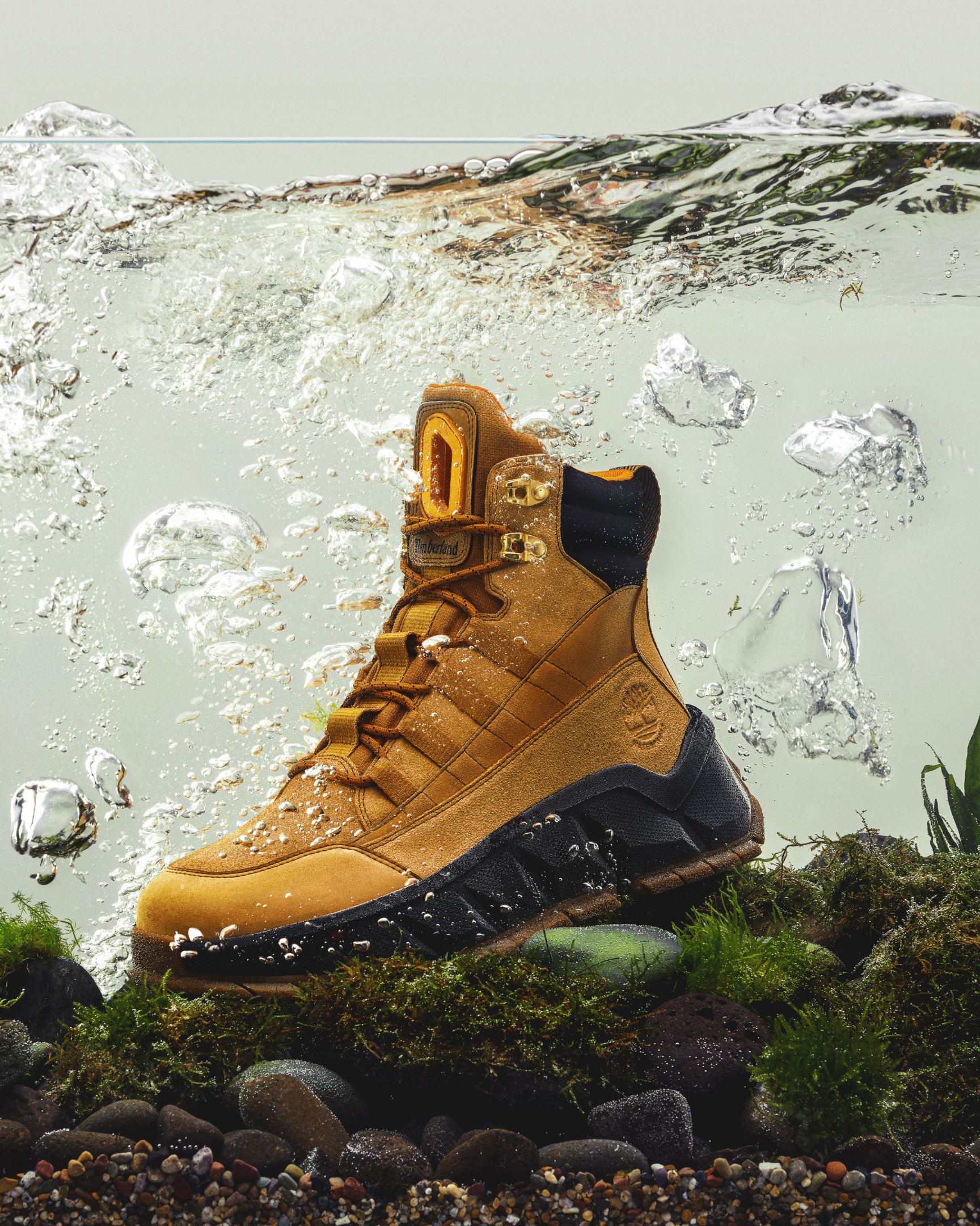 Timberland Greenstride Turbo TBL boot submerged in water tank with rocks and plants