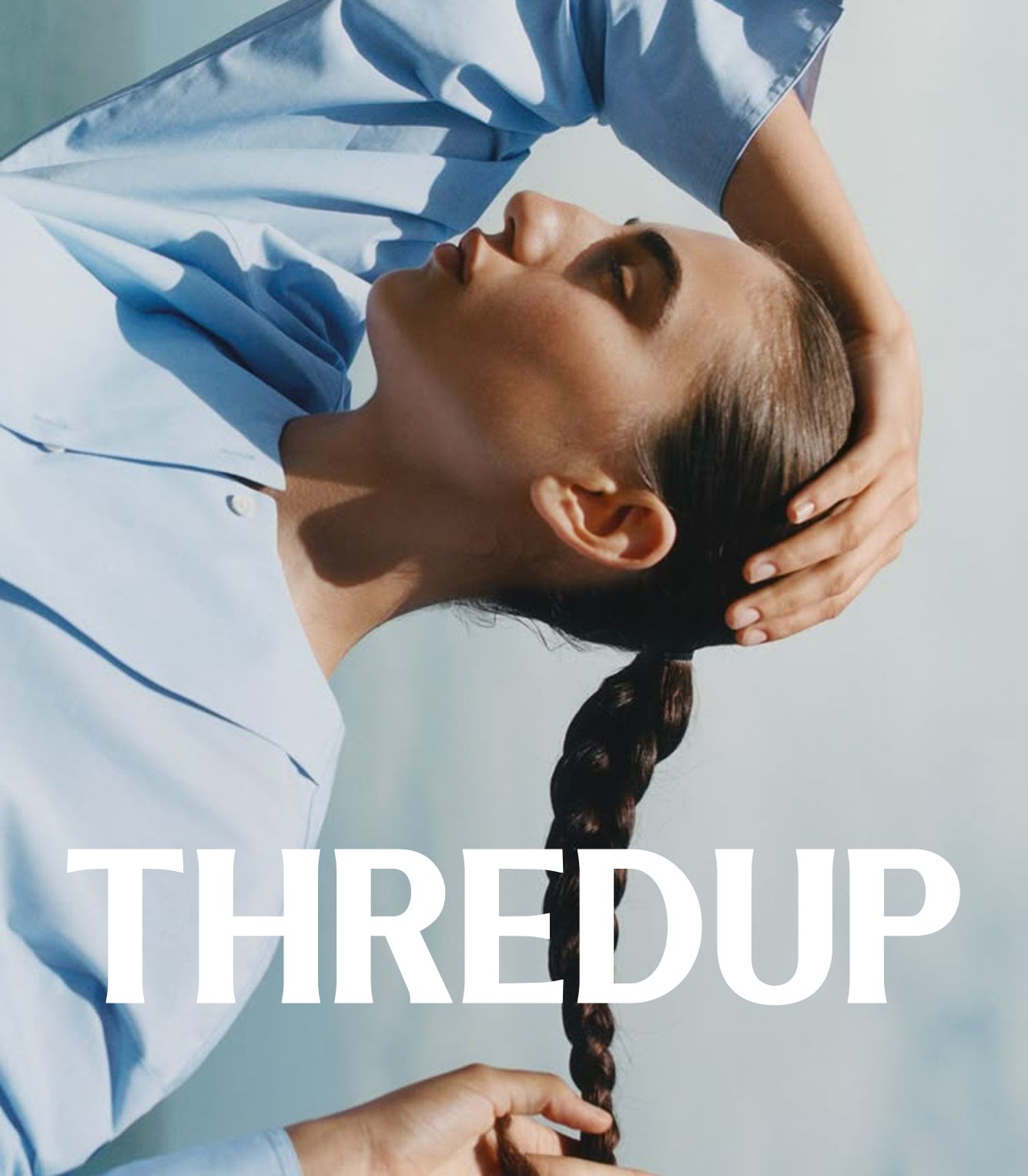 A person in a light blue shirt holds their braided hair, eyes closed, with the word "THREDUP" in bold white letters across the bottom.