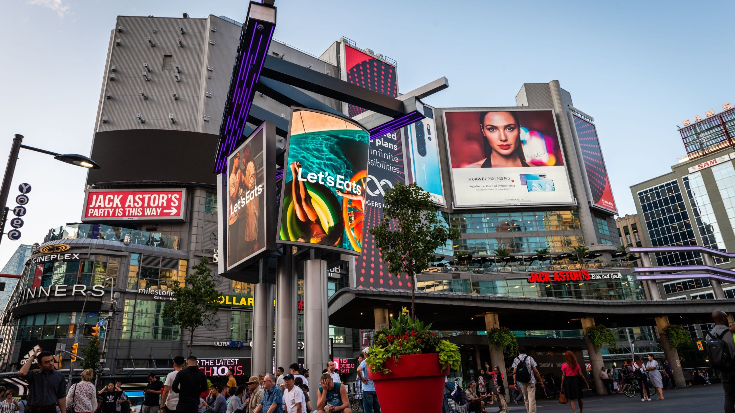Let's Eats Uber Eats ads on digital billboard screens in downtown city center