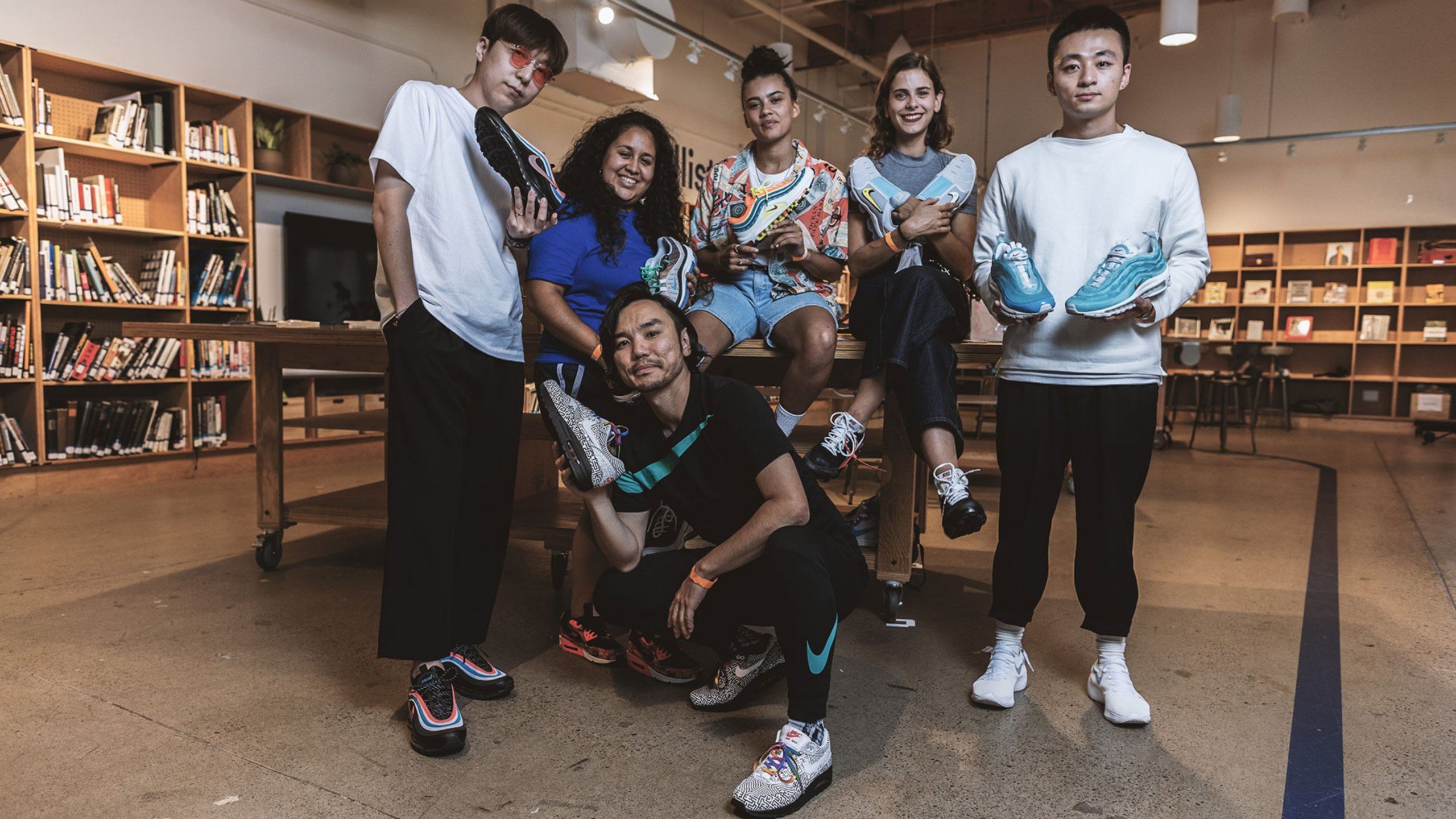 All desingers holding their airmax shoes together in group shot