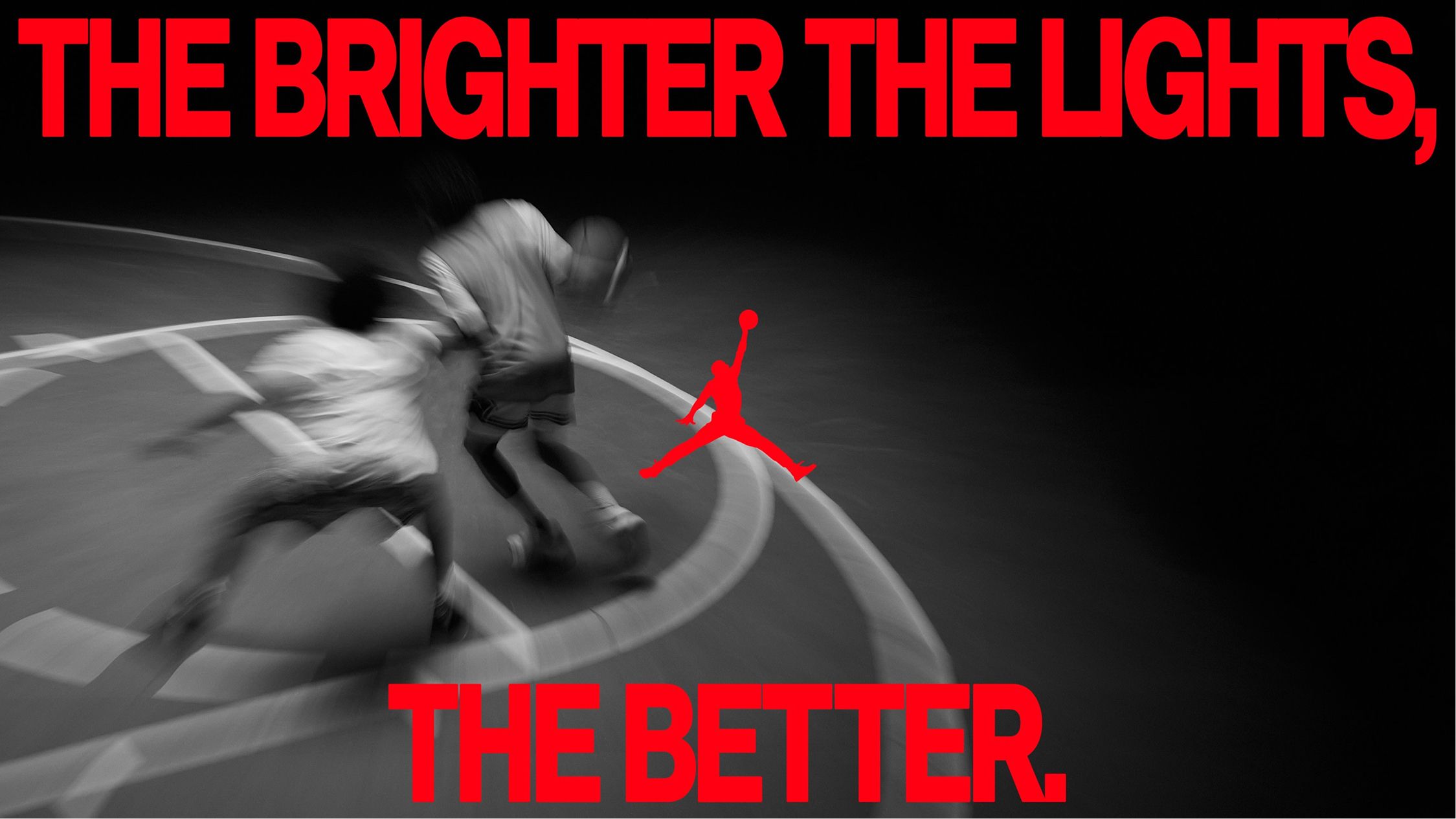 Two basketball players in motion on a court, with bold red text reading "The brighter the lights, the better" and a red Jumpman logo at the center.