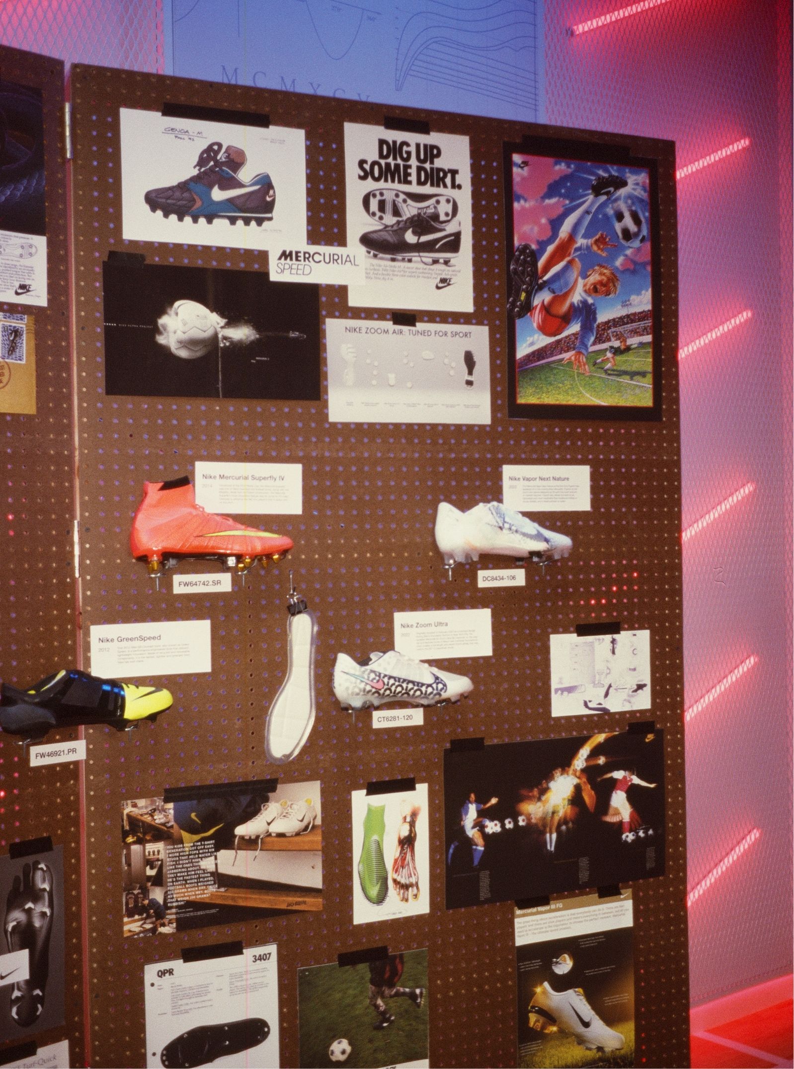 pegboard with prints and shoes showing the history of nike soccer / football boots