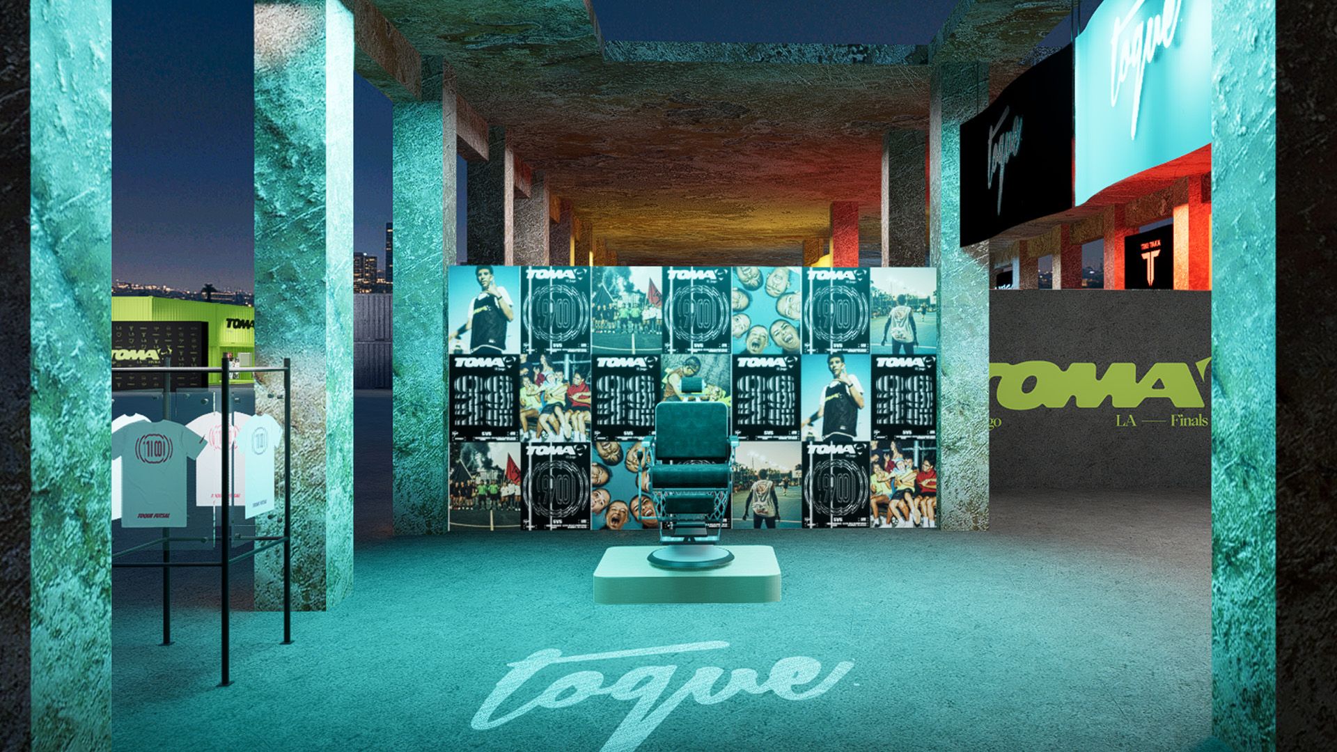 A modern barbershop setup with a central barber chair, wall of posters, clothing rack on the left, and branded signage in an industrial-style space.