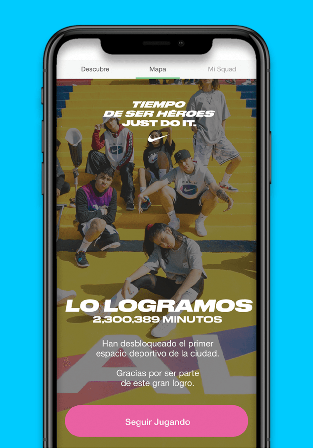 App screen showing several young people sitting on stairs with text Tiempo de ser heroes Just Do It. Lo Logramos 2,300,389 Minutos. Button reads Seguir Jugando
